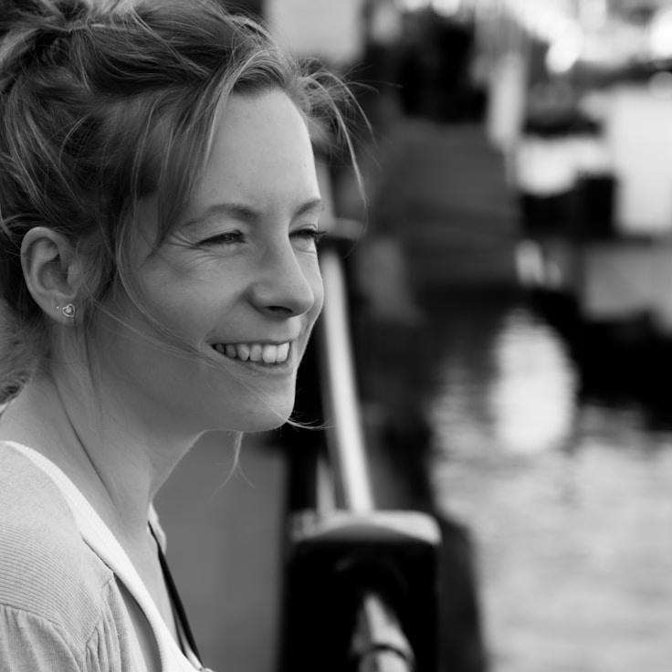 Ava Singh, Lead Design Curator at StableMindRoute, reviewing corporate floral arrangements